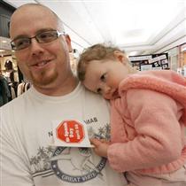 Chris Etches holds his daughter Chelsea, 2, at the Devonshire Mall Saturday during the No Spank Day family event. The child abuse prevention committee of the Windsor-Essex Children's Aid Society put on the event.