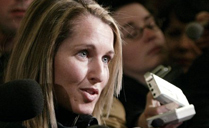 Former Olympic athlete Myriam Bedard talks with reporters following her testimony before the Commons public accounts committee in Ottawa Wednesday, March 24, 2004
